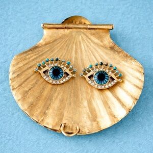 Protective eye stud earrings.